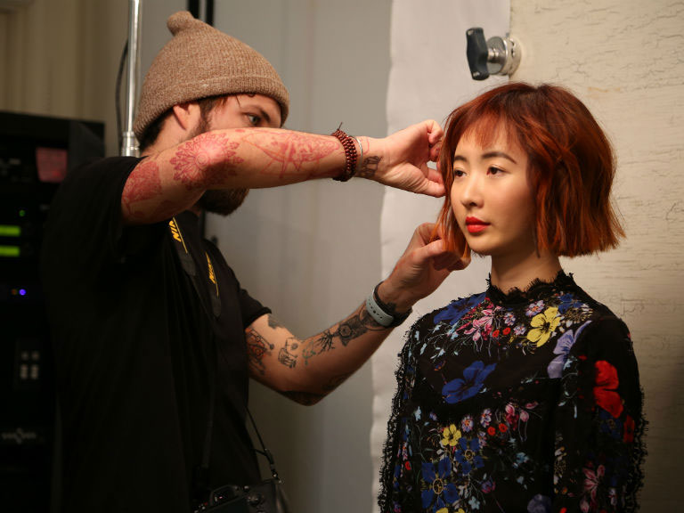 David on set, tweaks the style before the final shot. | Source: Aveda