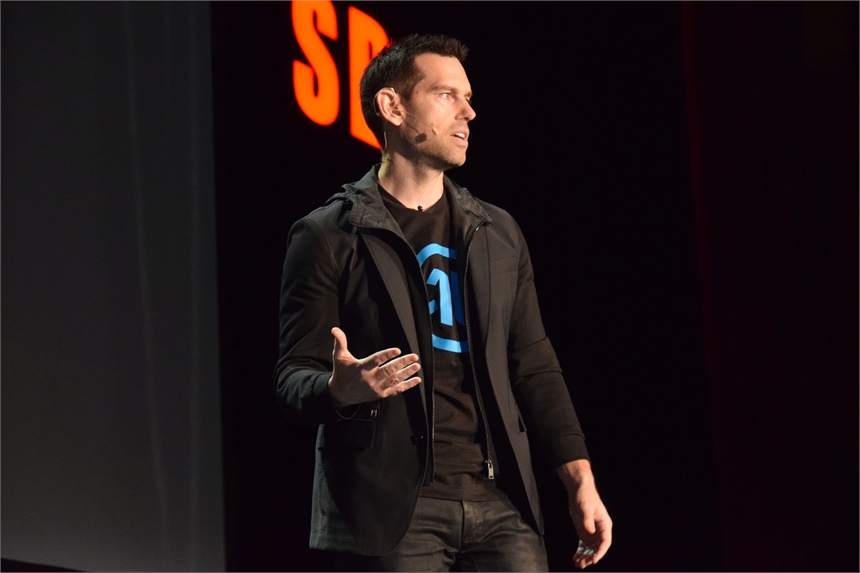 Quest Nutrition's Tom Bilyeu encourages attendees to follow their passion. "Mind the gap between where you are today and where you want to be," he says.