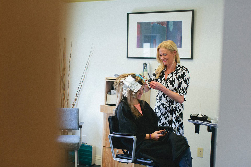 A Salon U stylist puts color in a client's hair. Photo by Graham Yelton.